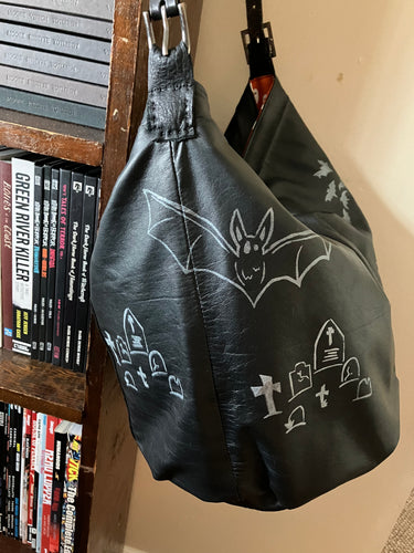 Bucket bag with Graves and Bats printed around the Bag